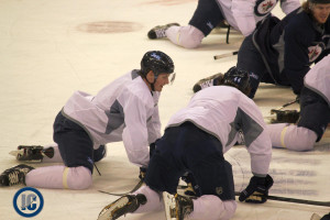 Trouba and Bogosian stretch at practice