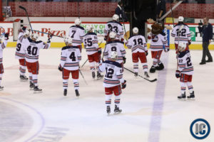 Jets raising sticks at centre ice