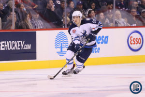 Jack Roslovic heads up ice with puck