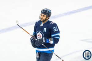 Dustin Byfuglien looking at bench